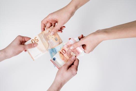 Two pairs of hands exchanging Euro banknotes, symbolizing finance and transaction.